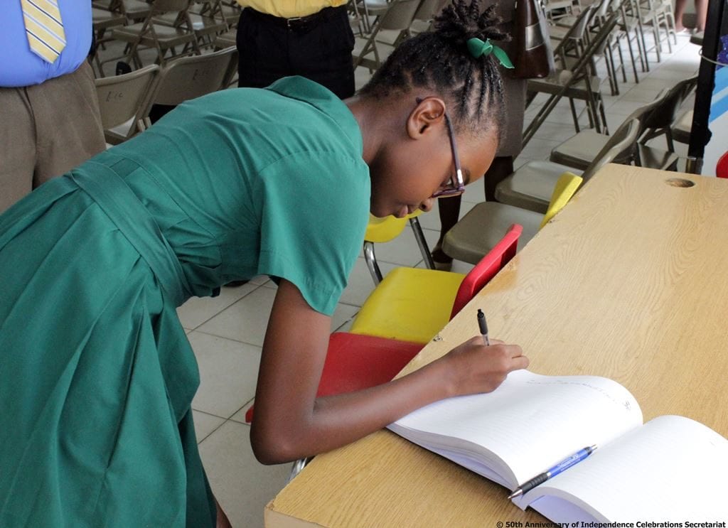 Head Girl of the Seventh-Day Adventist Primary School, Brianna Hardy signing the Pledge Book. (S.Medford)