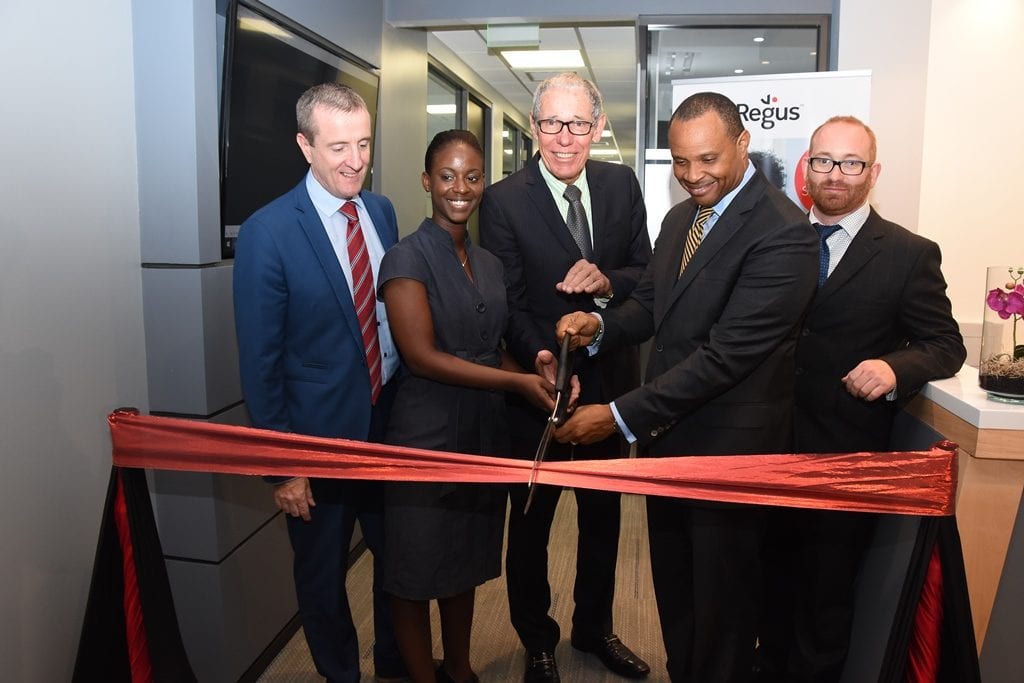 Regus Managing Director, Mark Linehan; Customer Service Rep, Cheria Kippins; Businessman, Ralph "Bizzy" Williams; Finance Minister, Christoper Sinckler and Regus General Manager, Stuart May cutting the ribbon to officially launch the new Business Centre at One Welches, St. Thomas. (C.Pitt/BGIS)