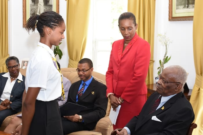 Awardee of CXC’s Natural Science prize for CAPE, Larissa Wiltshire of Queen’s College, Guyana, greeting the Governor-General of Barbados, Sir Elliott Belgrave in the presence of Permanent Secretary in the Ministry of Education, June Chandler. Also featured are Deputy Chief Education Officer, Joy Adamson (left) and CXC Assistant Registrar and Communication Specialist, Cleveland Sam. (A.Gaskin/BGIS)