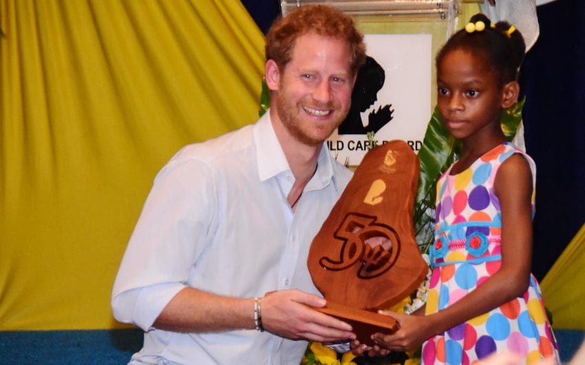 His Royal Highness Prince Henry of Wales receiving a 50th Anniversary of Independence token at the official opening of two centres at the Nightingale Children’s Village. (C.Pitt/BGIS)