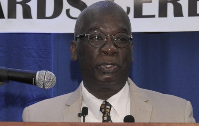 Minister of Education, Science, Technology and Innovation, Ronald Jones, addresses students of the American University of Barbados (AUB) at the Orientation and Awards Ceremony. (C.Pitt/BGIS)